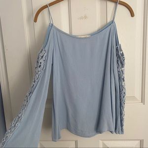 light blue top with cut out shoulder